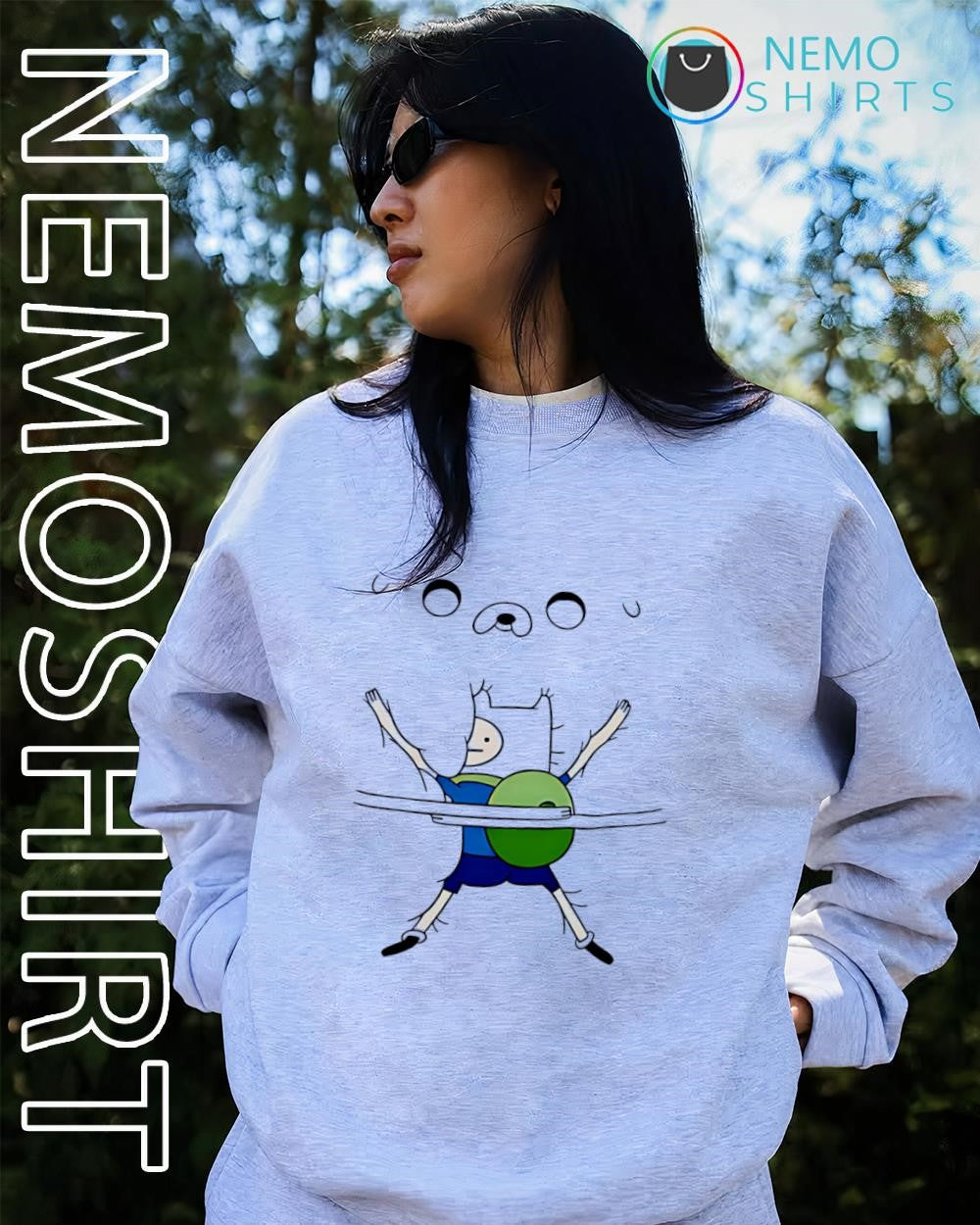 Finn holding Jake Adventure Time shirt