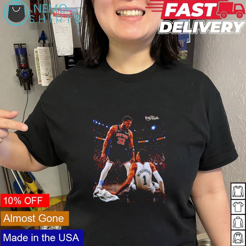 Karl-Anthony Towns celebrating a victory over San Antonio Spurs player Wemby shirt