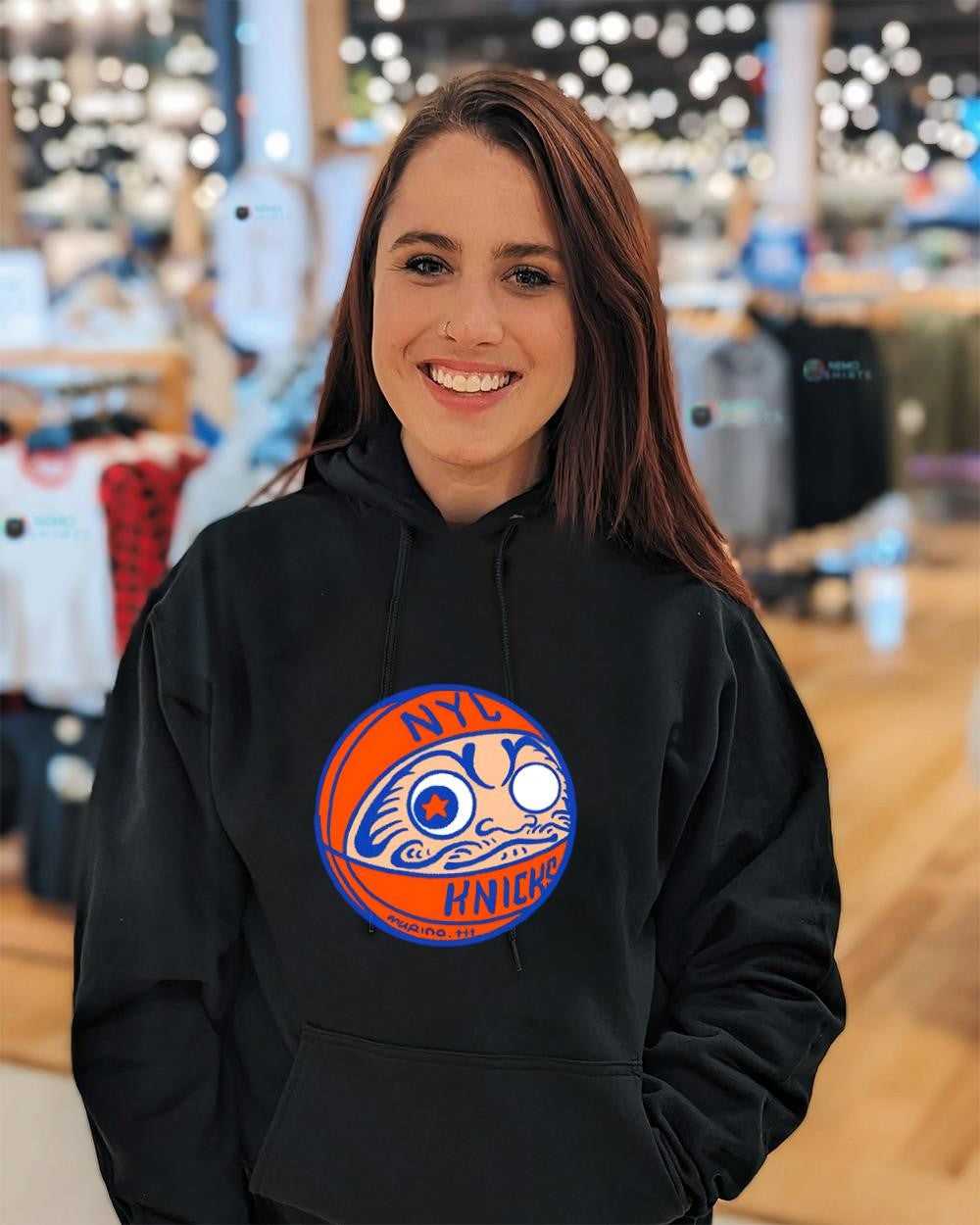 New York Knicks basketball logo with a Japanese Daruma doll shirt