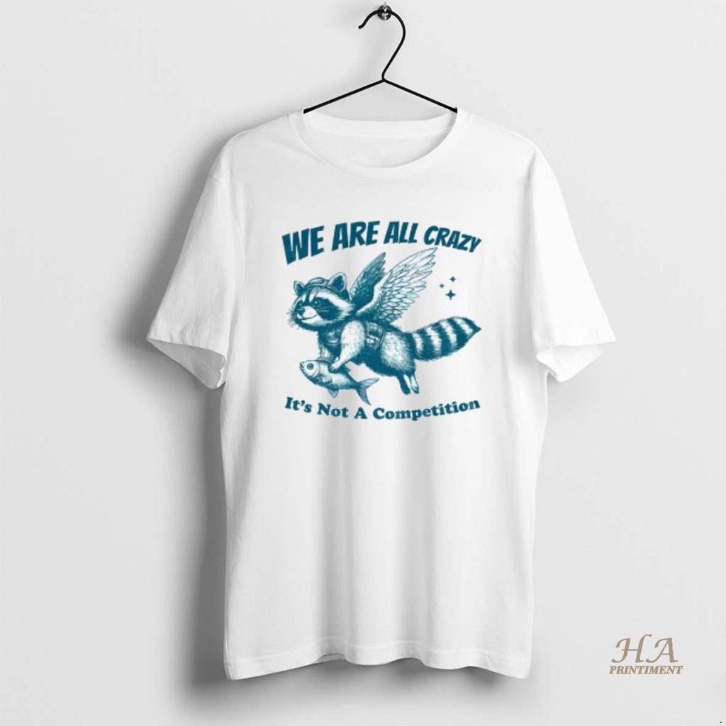 Official Raccoon Holding Fish Fly We Are All Crazy Its Not A Competition Shirt Hoodie Sweatshirt | PurePodTees.com