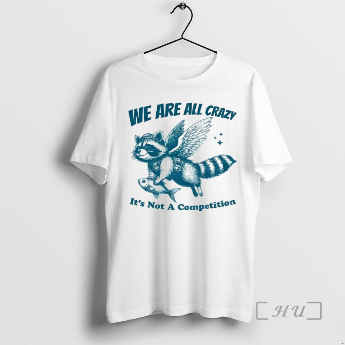Trending Raccoon Holding Fish Fly We Are All Crazy Its Not A Competition Premium Shirt Hoodie Sweatshirt | PurePodTees.com