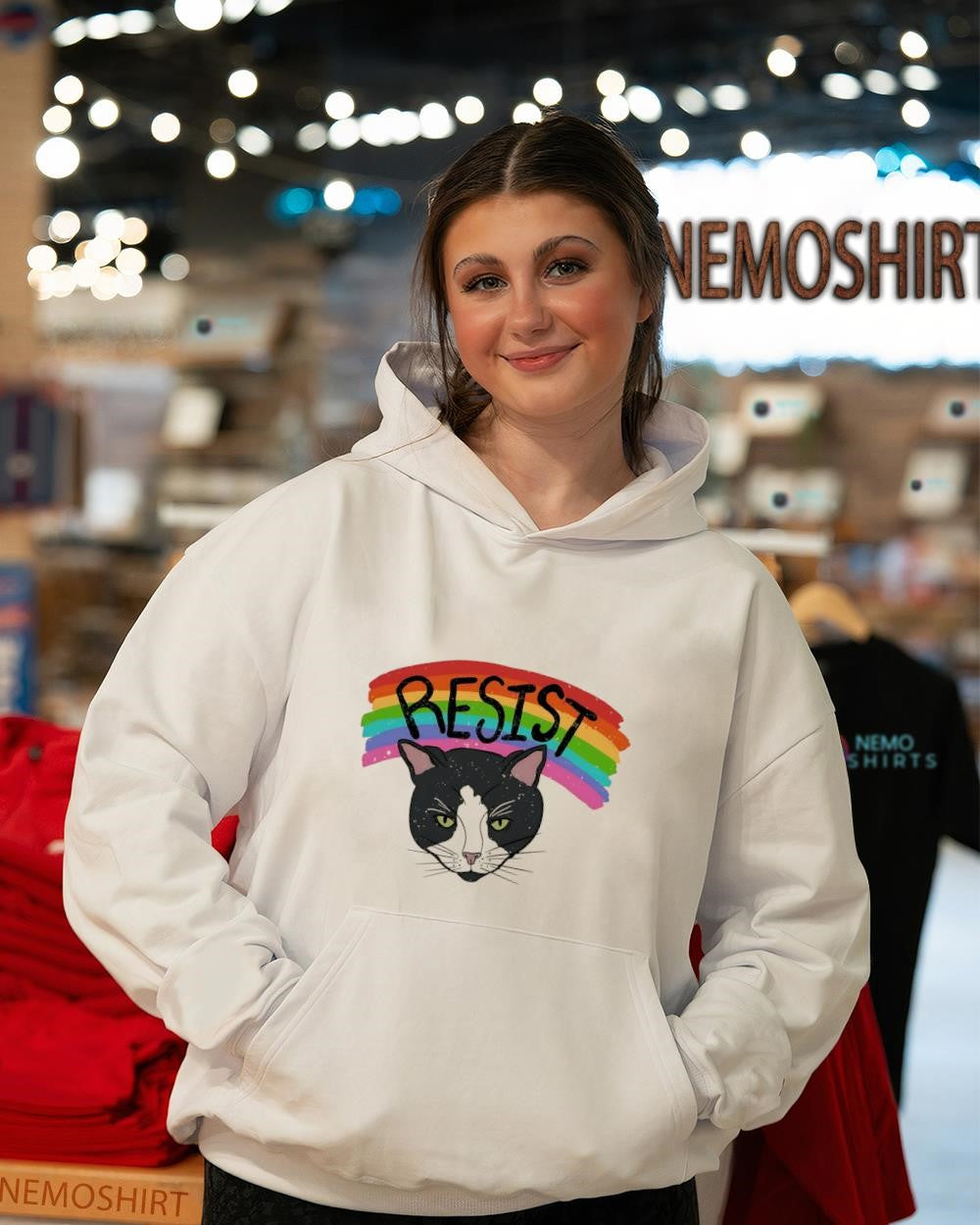 Tuxedo cat under rainbow LGBT pride shirt