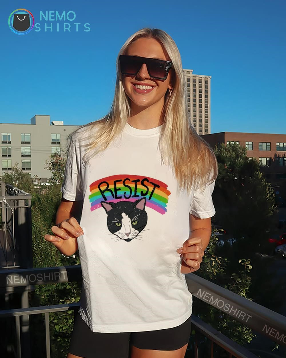 Tuxedo cat under rainbow LGBT pride shirt