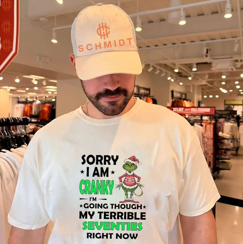Sorry I am cranky I’m going through my terrible seventies right now Grinch shirt
