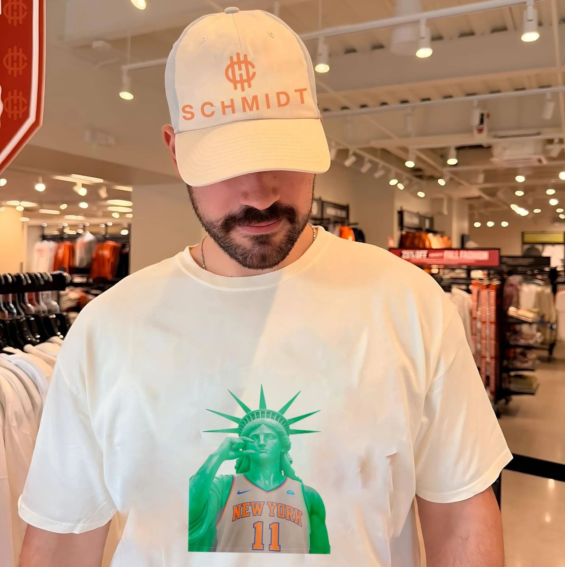 Statue of Liberty wearing NY Knicks jersey too small hand gesture shirt